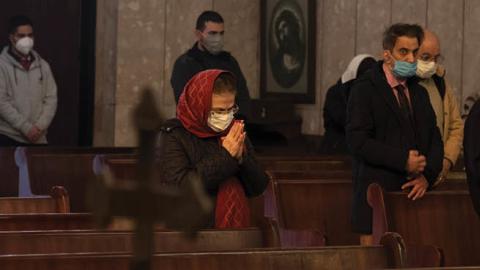 Iranian-Christians pray during a New Year mass prayer ceremony in the Saint Gregory church in Tehran on January 1, 2021. (Getty Images)