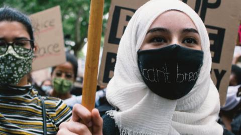 Woman in a hijab takes part in Black Lives Matter protest in Cologne, Germany, on June 7, 2020. (Photo by Ying Tang/NurPhoto via Getty Images)