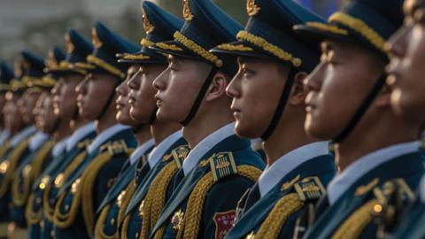 Members of a People's Liberation Army band stand together at a ceremony marking the 100th anniversary of the Communist Party on July 1, 2021, at Tiananmen Square in Beijing, China. (Getty Images)