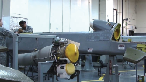 Airmen prepare an AGM-86B air-launched cruise missile for a nuclear weapons system evaluation program test flight at Minot Air Force Base on April 10, 2013. (Tech Sgt. Mark Bell/Air Force Global Strike Command Public Affairs)