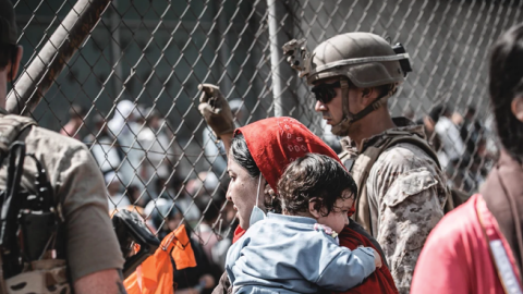 Evacuees await their departure at Hamid Karzai International Airport in Kabul, Afghanistan, August 23, 2021. (Gunnery Sergeant Melissa Marnell/USMC)