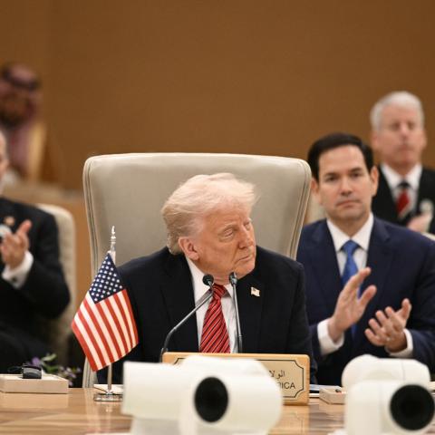 Members of the US delegation applaud as US President Donald Trump addresses leaders in Riyadh on May 14, 2025. (Brendan Smialowski via Getty Images)