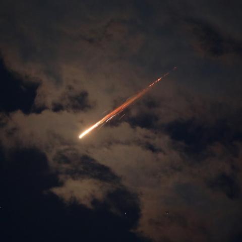 Caption Some of the missiles launched from Iran are spotted in the skies on February 28, 2026, in the West Bank. (Getty Images) Share to Twitter