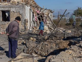 A local resident stands outside of a destroyed building following a missile attack in Odesa, Ukraine, on November 17, 2024. (Oleksandr Gimanov/AFP via Getty Images)