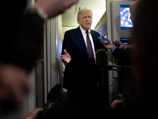 President Donald Trump speaks to members of the media on board Air Force One on March 15, 2026. (Getty Images)