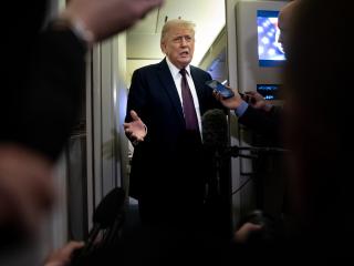 President Donald Trump speaks to members of the media on board Air Force One on March 15, 2026. (Getty Images)