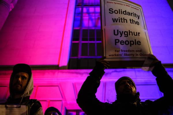 Uyghur rights activists stage a demonstration outside the Chinese embassy in London, England, on January 5, 2020. (David Cliff/NurPhoto via Getty Images)