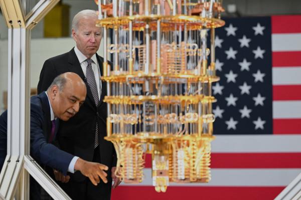 Joe Biden looks at a quantum computer with IBM CEO Arvind Krishna as he tours the IBM facility in Poughkeepsie, New York, on October 6, 2022. (Mandel Ngan/AFP via Getty Images)