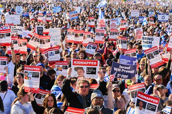 Participants hold up posters of hostages as thousands of people attend the March for Israel on the National Mall on November 14, 2023, in Washington, DC. (Photo by Noam Galai/Getty Images)