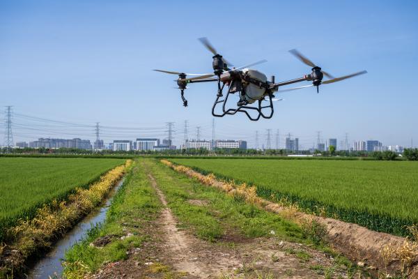 A drone sprays pesticides at Baiyutan Modern Agriculture Demonstration Park in Kunshan, China, on April 18, 2024. (Photo by Costfoto/NurPhoto via Getty Images)