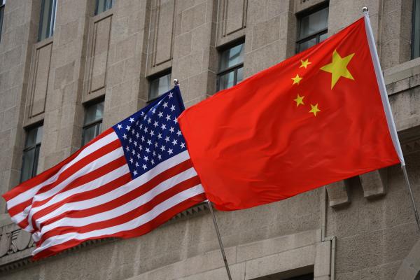 The national flags of the United States and China flutter at the Fairmont Peace Hotel on April 25, 2024, in Shanghai, China. (Photo by Wang Gang/VCG via Getty Images)