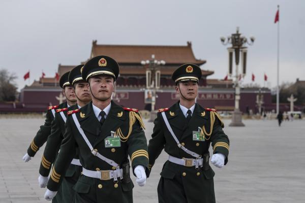 Members of the Peoples Liberation Army flag honor guard march in Tiananmen Square on March 11, 2024, in Beijing, China. (Photo by Kevin Frayer/Getty Images)