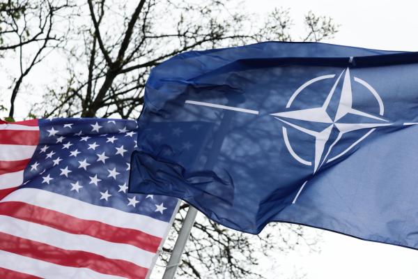 American and NATO flags are seen in Warsaw, Poland, on April 12, 2024. (Jakub Porzycki/NurPhoto via Getty Images)