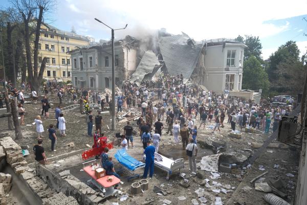 People clear rubble at a Ukrainian children's hospital which was partially destroyed by a Russian missile strike on July 8, 2024, in Kyiv, Ukraine. (Vitalii Nosach/Global Images Ukraine via Getty Images)