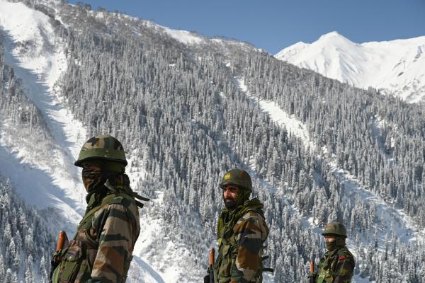 Indian army soldiers walk near Zojila mountain pass that connects Srinagar to Ladakh on February 28, 2021. (Tauseef Mustafa/AFP via Getty Images)
