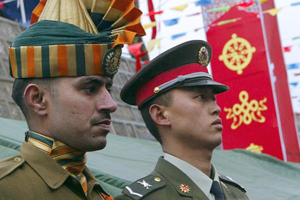 An Indian soldier and his Chinese counterpart at a ceremony marking the re-opening of the China-India border, July 6, 2006 (DESHAKALYAN CHOWDHURY/AFP/Getty Images)