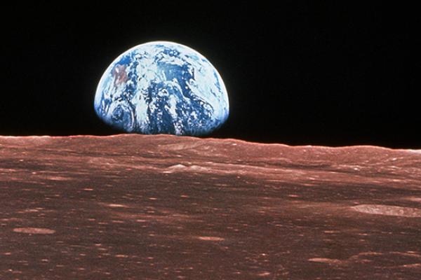 Apollo 11 view of the Earth rising over the surface of the moon (NASA/SCIENCE PHOTO LABORATORY)