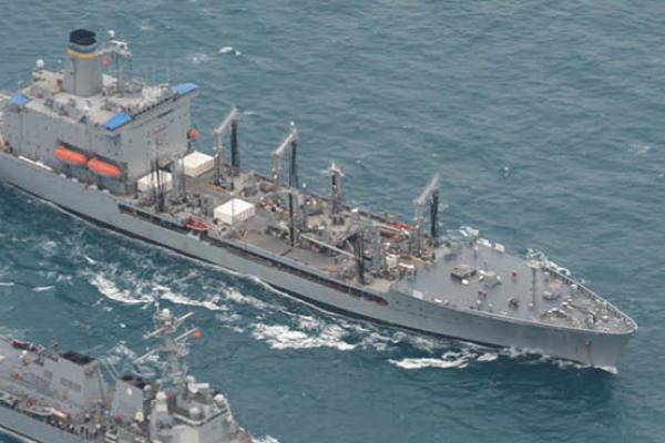 The guided-missile destroyer USS Sampson, bottom, and underway replenishment oiler USNS Pecos conduct a replenishment at sea. (U.S. Navy)