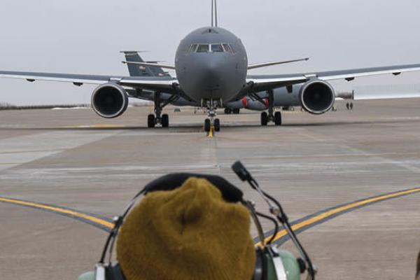 An Aircraft Maintenance Squadron crew chief marshals the KC-46A Pegasus on the flight line on February 21, 2019, at McConnell Air Force Base, Wichita, Kansas. (Alexi Myrick/US Air Force)