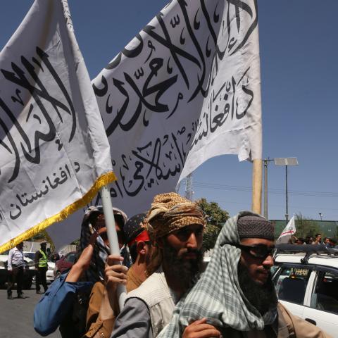 Afghan people holding flags in Kabul, Afghanistan, on August 15, 2023. (Bilal Guler/Anadolu Agency via Getty Images)