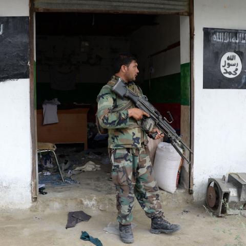 Afghan security forces patrol during ongoing clashes between security forces and Islamic State militants in eastern Nangarhar province on July 26, 2016. (Noorullah Shirzada/AFP via Getty Images)