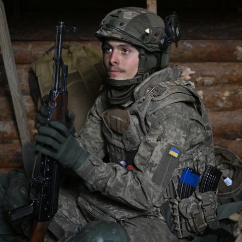 A recruit of the 28th Separate Mechanized Brigade takes a break in a dugout during field tactical training at an undisclosed location in the Donetsk Region, Ukraine, on May 1, 2025 (Genya Savilov via Getty Images)
