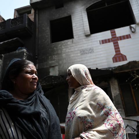 Pakistani Christian Perveen Bibi weeps outside the torched Saint John Church in Jaranwala on the outskirts of Faisalabad on August 17, 2023. (Aamir Qureshi via Getty Images)