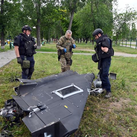 Ukrainian explosives experts and police officers examine parts of a Shahed 136 military drone following an air attack in Kharkiv on June 4, 2025, amid the Russian invasion of Ukraine. (Sergey Bobok via Getty Images)