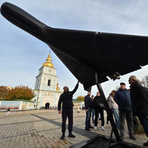 People look at an Iranian-designed Shahed 136, (Geranium-2) drone of Russian Army at an open-air exhibition of destroyed Russian equipment near Saint Michael's Golden-Domed Cathedral in Kyiv on November 2, 2025, amid the Russian invasion of Ukraine. (Photo by Sergei SUPINSKY / AFP) (Photo by SERGEI SUPINSKY/AFP via Getty Images)