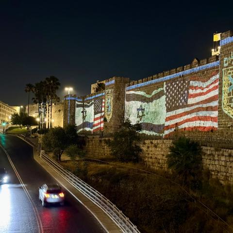 A photo shows US and Israeli flags projected on the historic walls of the Old City near Hebron Gate in Jerusalem after the United States carried out airstrikes on Iran's nuclear sites on June 22, 2025. (Photo by Gazi Samad/Anadolu via Getty Images)