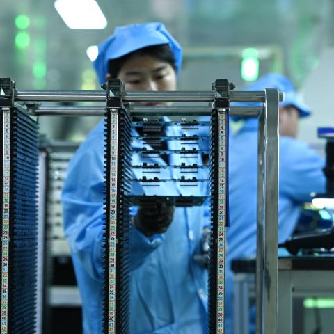 An engineer tests the quality of chips for a steering controller at a workshop on March 5, 2026, in Yiwu, China. (Getty Images)